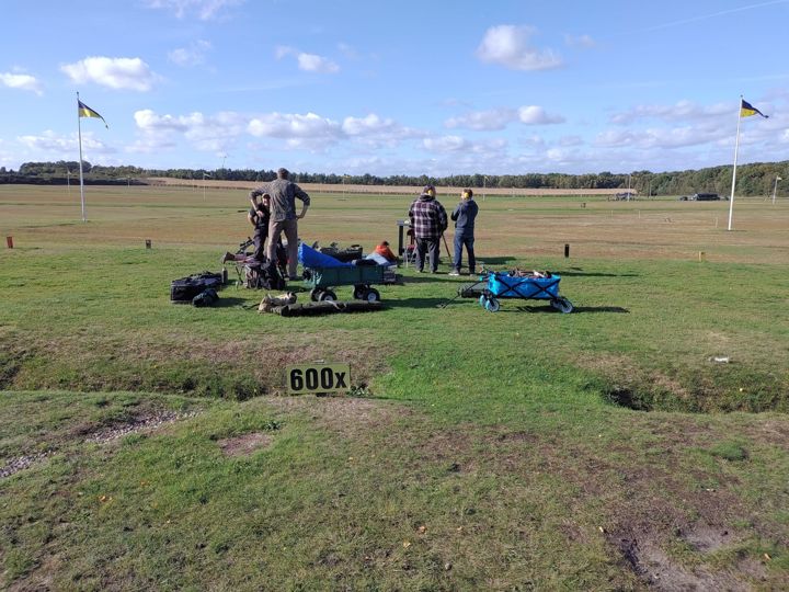 The 600 yard point at Bisley, with members and their equipment on the grass